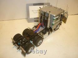 A Franklin Mint scale model of a 1979 Freightliner & trailer, papers, all boxed