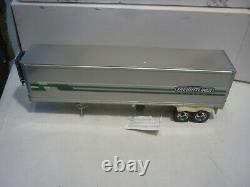 A Franklin Mint scale model of a 1979 Freightliner & trailer, papers, all boxed