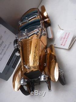 A Franklin mint 1921 Rolls Royce silver ghost copper body, boxed