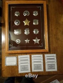 Franklin Mint framed set of 12 sterling silver Western Lawmen Badges