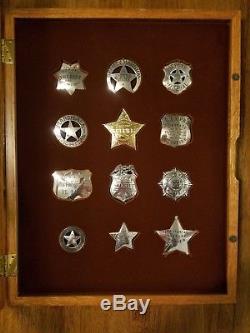 Franklin Mint framed set of 12 sterling silver Western Lawmen Badges